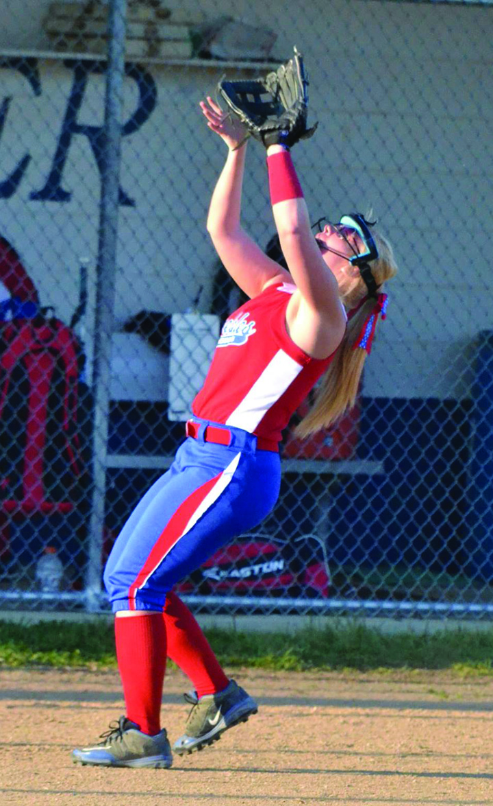 The bat and glove of senior Kaitlin Toller has been an integral part of the success of the 2016 Peebles Lady Indians.  Photo by Mark Carpenter.