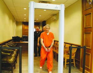 Arthur D. Moman is led from the courtroom after being found guilty of murder. Photo by Patricia Beech - People's Defender