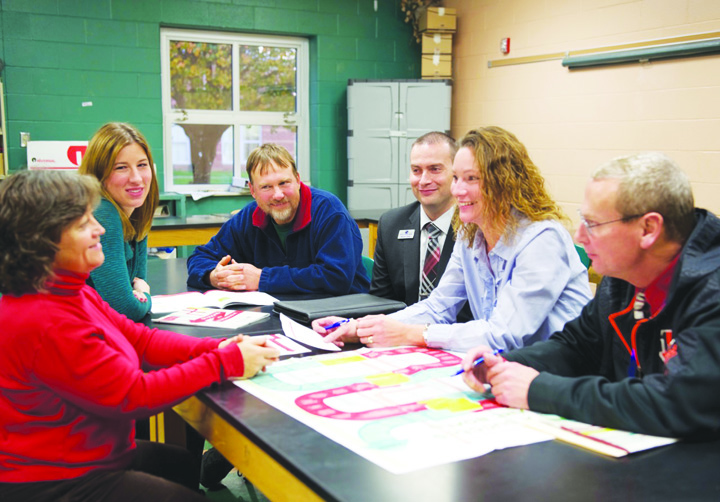 Meeting at West Union High School to discuss plans for the Junior Achievement program are, from left, Karen Cunningham (West Union Seventh Grade Social Studies Teacher), Bethany Pistole (First State Bank), Dan Wickerham (Adams/Brown Recycling), Brandon Fawley (Fifth Third Bank), Kelly Boerger (North Adams Seventh Grade Social Studies Teacher), and Stan Doddridge (Peebles Seventh Grade Social Studies Teacher).