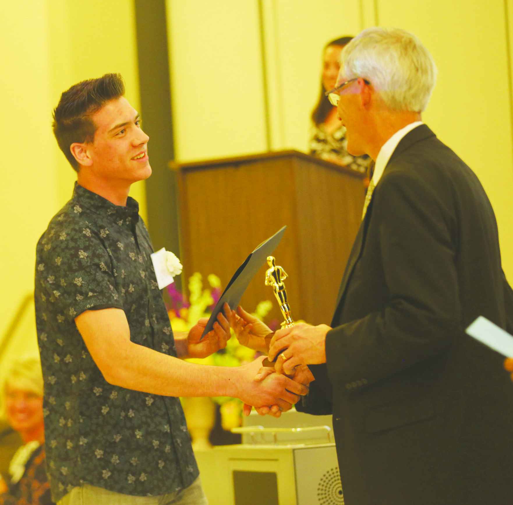 Jesse Hall, Adams County Outstanding Student, left, receives his award from Richard Seas, Superintendent of the Adams County/Ohio Valley School District.