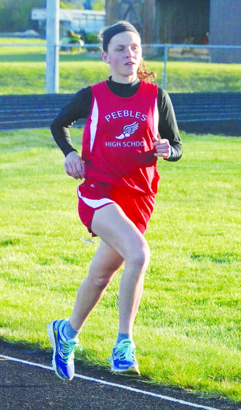 Peebles freshman Jenny Seas brought home a pair of SHAC titles, winning both the Girls 1600 Meter Run and the Girls 800 Meter Run.  Photo by Mark Carpenter.