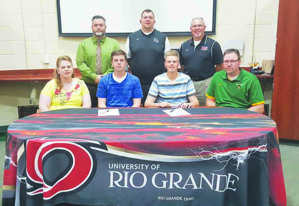 Present at the May 12 signing ceremony at North Adams High School were: Front row, from left, Christa Meade (mother), Cole Meade, Trey Meade, and Rob Meade (father); Back row, from left, Matt Young, NAHS Principal, Tony Williams, NAHS Athletic Director, and Brad Warnimont, Head Baseball Coach at Rio Grande.  Photo by Mark Carpenter.