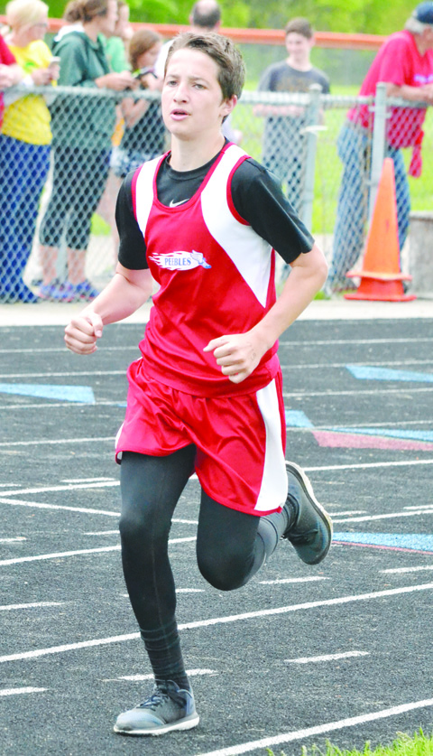 Peebles eighth grader Chase Meade won the 1600 Meter Run in a time of 5:52 at Monday’s Adams County Junior High Track Meet, his best time of the spring season. Photo by Mark Carpenter