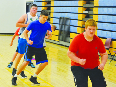 This group of Manchester football players works on agility as preparations begin for the 2016 season.