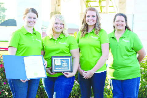 From Farm Credit Mid-America and honored on the opening night of the fair with the Friend of 4-H Award were, from left, Rudi Pitzer Perry, Cara Lawson, Lindsay Bloom, and Heather Simpkins.