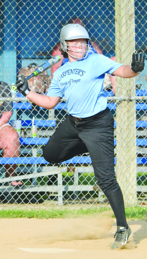 Manchester’s Yasmin Lucas needs a hop, skip, and a jump to get out of the way of an errant pitch during last week’s AA League tournament semi-final game in Hillsboro. 