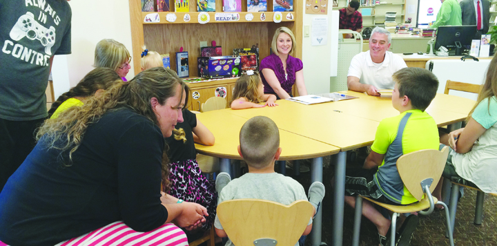 U.S. Congressman Brad Wenstrup, far right, visited the North Adams Library on June 28 and participated in Story Time with the kids, reading "Fourth of July Fireworks."