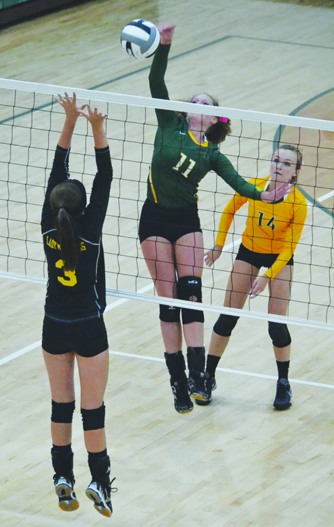 North Adams’ Abby Campton (11) goes up for a kill in the final match of the 2016 SHAC Volleyball Preview.