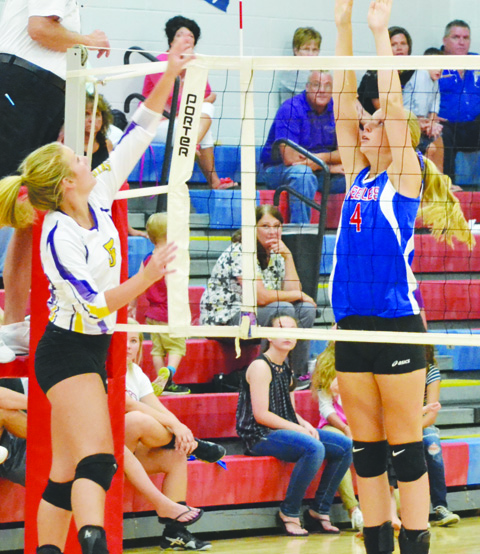Peebles’ Josie Myers, right, goes up at the net for the attempted block in Wednesday’s match with Lucasville Valley.