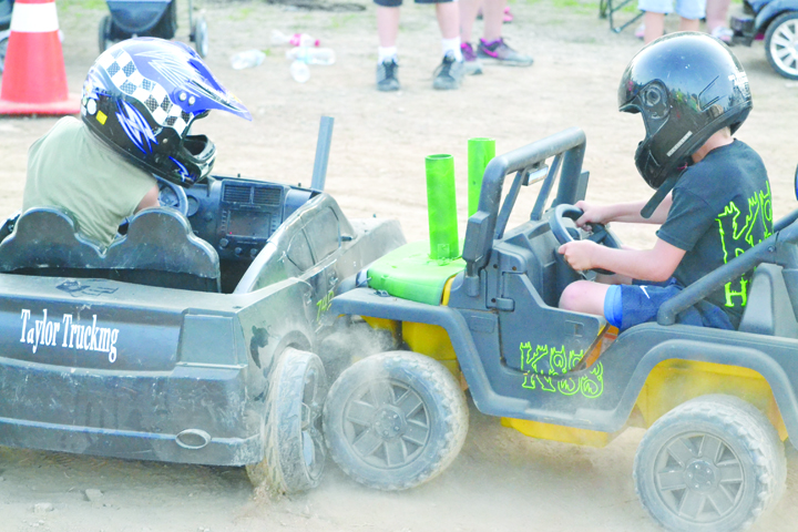 These two young men battled to the end in Saturday night’s Power Wheels Derby, with both being declared as first-place winners in the competition.  Photo by Mark Carpenter