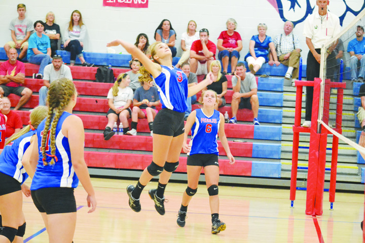 Peebles freshman Tatum Arey goes high for a kill attempt during the Lady Indians’ four-set victory over Whiteoak last week.