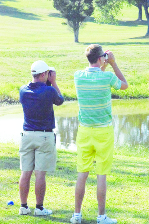 They aren’t taking a break to do some bird watching on the golf course, but North Adams’ Patrick England, left, and West Union’s Craig Horton check out all the curves and angles before teeing off on hole 10 at Hilltop in the second round of the Boys SHAC Golf Tournament.