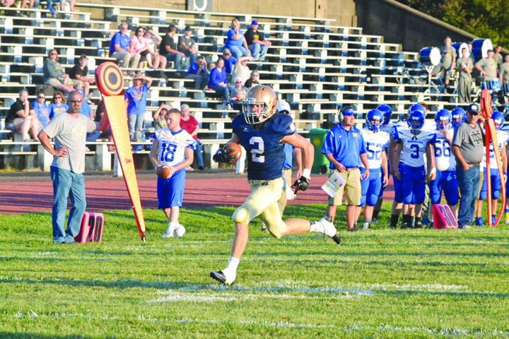 This sight haunted the Manchester Greyhounds and their faithful in last Friday night’s game with Portsmouth Notre Dame as Notre Dame’s Sam Kayser heads to the end zone on a first quarter punt return that gave the home team a 14-0 advantage, in an eventual 59-0 victory.