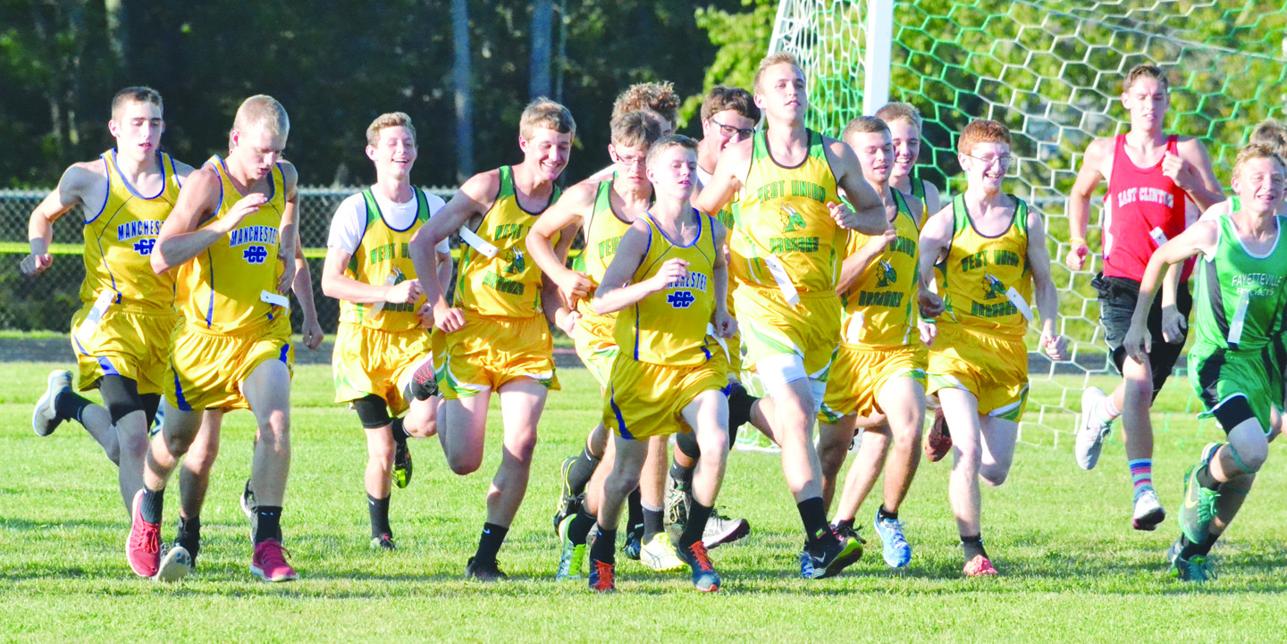 And they’re off!  Part of the group of 66 runners in the high school varsity boys race at last week’s Dragon Run take off  at the start line to begin their trip around the 5000 meter course.