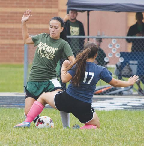 North Adams senior Kitasha Mesmer battles for possession with Peebles’ Kim Kreal (17) during this action from last weekend’s “Kickin Cancer” event at North Adams High School.  Mesmer scored her first goal of the season to help her team to a 3-1 win over the Lady Indians.
