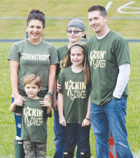 The family of 11-year old Drew Reid, center with hat, was in attendance at Saturday’s “Kickin Cancer” soccer games at North Adams High School.