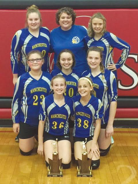 The seventh grade Manchester Lady Hounds were crowned as champions of the SHAC Tournament last weekend, knocking off North Adams 22-25, 25-9, 25-10.  They are pictured here with their hardware from the regular season and tournament,  Front row, from left, Kayden Francis and Mckenzie Morrison; Middle row, from left, Grace Hackney, Jada Francis, and Makenzie Fischer; Back row, from left, Zoe Arnold, Head Coach Crystal Roberts, and Santana Stanfield.