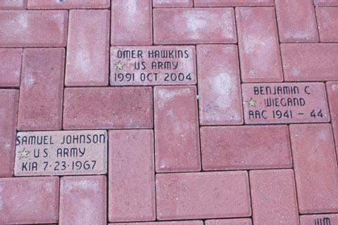 The brick memorials in front of the North Adams Library with the gold stars signify a veteran who was killed in battle.