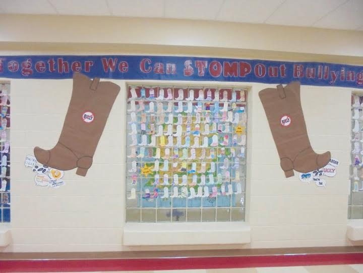 The boots are displayed on the wall at Peebles Elementary after students wrote on them their suggestions for ending bullying.