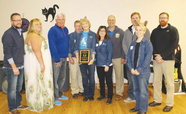 At the annual Humane Society Howl-O-Ween Dinner and Auction, Karen Franklin was honored with the Community Service Award.  Pictured here at that presentation are, from left, Ryan Chadwick, Deanna Turner, Ty Pell, Brian Mason, Karen Franklin, Barbara Jones, Brian Baldridge, Paul Worley, Jessica Huxmann, and Todd Mitchell.