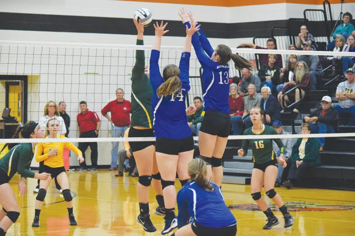 With the size of both teams, there was a lot of action at the net during last week’s district semi-final volleyball match in Waverly.  Here, North Adams’ Avery Harper attempts to find an open spot over the outstretched arms of a pair of Southeastern blockers.