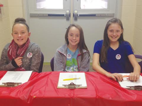 Pictured here are sixth grade students supervising the election process as poll workers.