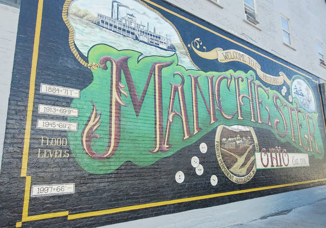 Another masterpiece beautifully marks the architecture of Adams County as veteran mural artist Pamela Kellough, of Ross County, Ohio, chas ompleted the mural in Manchester, Ohio. (Photo by Mark Carpenter)
