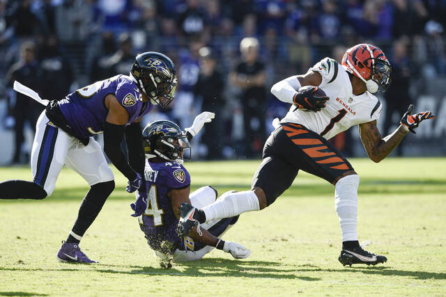 Cincinnati Bengals wide receiver Ja'Marr Chase, left, and