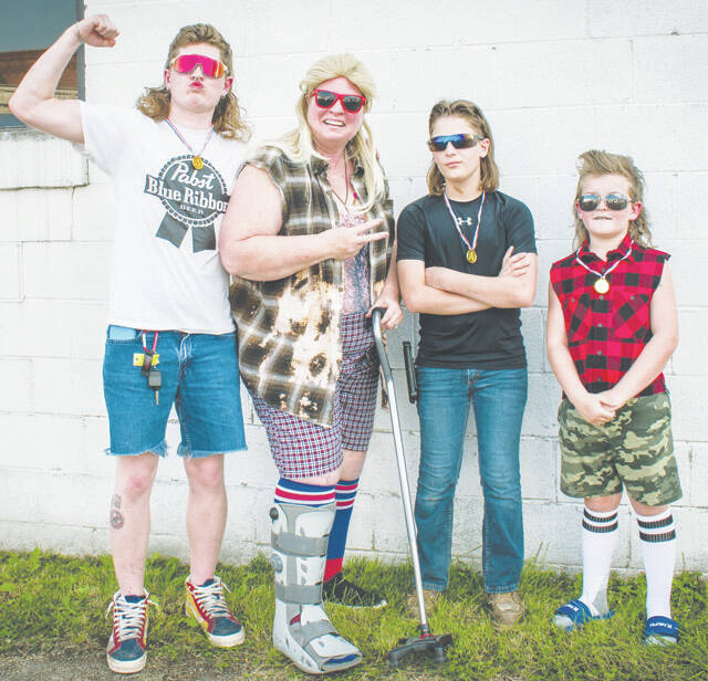 <p>OTD Mullet Contest Winners: From left, Adult Division - Winner, Lethal Weapon; Cynthia Howard - Lions Club President; Teen Division - Winner, Kentucky Mud Flap; Kid Division - Winner, Boomer (Photo courtesy of Andy Baucom Photography)</p>