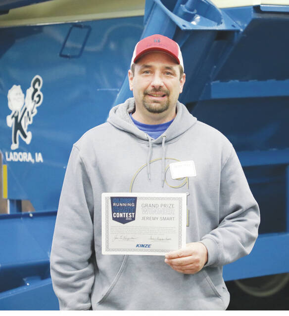Ohio farmer Jeremy Smart is a co-winner in a national contest conducted by Kinze Manufacturing to find the companys oldest grain cart that is still operating.