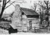 
			
				                                Pictured is a contemporary view of Goerge Mefford’s 1787 log home. Saved from destruction several years ago, it was dismantled and rebuilt on the north end of Washington , Kentucky where it is maintained as a museum.
 
			
		